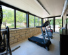 Adjacent to the home office is this fabulous, climate controlled home gym
