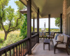 The main house has over 420 SF of covered porches for wonderful outdoor living rain or shine--and the long-distance Hill Country views off this porch are breathtaking...