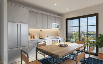 Chefs will love the open kitchen featuring sleek cabinetry and upscale stainless steel appliances. The light design scheme boasts pale finishes for a bright, clean aesthetic.
