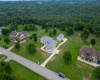 Aerial of property with greenbelt behind 
