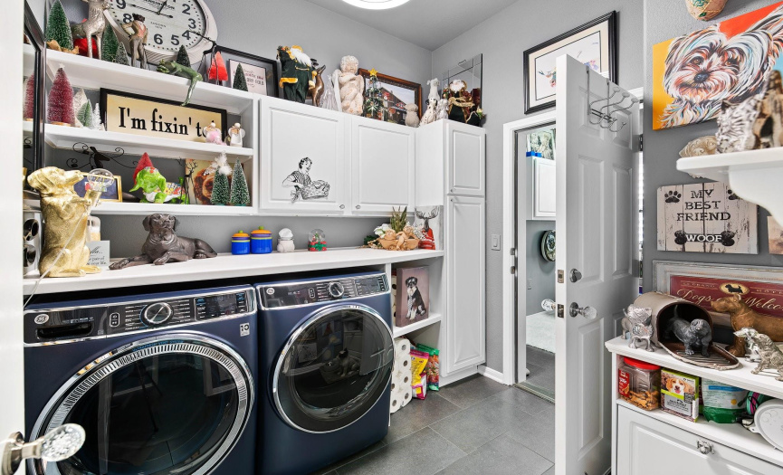 Laundry room with loads of extra storage.