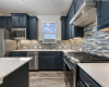Stunning blue cabinets with pull out drawers on all lower cabinets