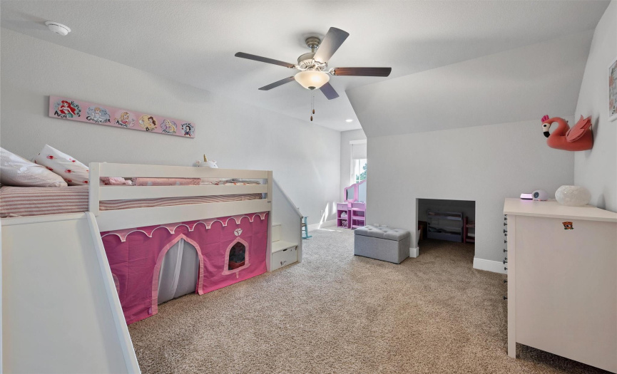 Another Bedroom with plush carpeting, a ceiling fan, a little nook area.