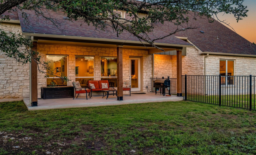 Outside, the covered patio provides the perfect spot to relax and enjoy the picturesque backyard, complete with a dog-run area for your furry best friends. 