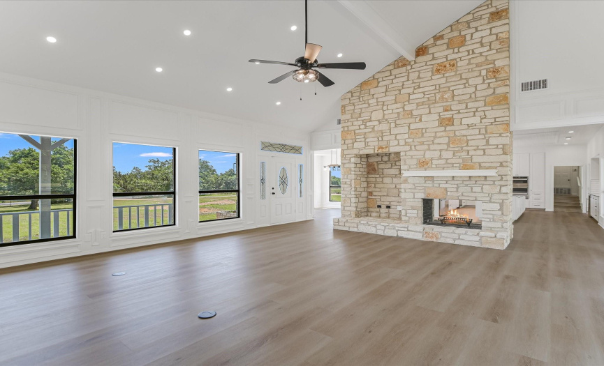 Open floorplan with an amazing wood burning see through fireplace