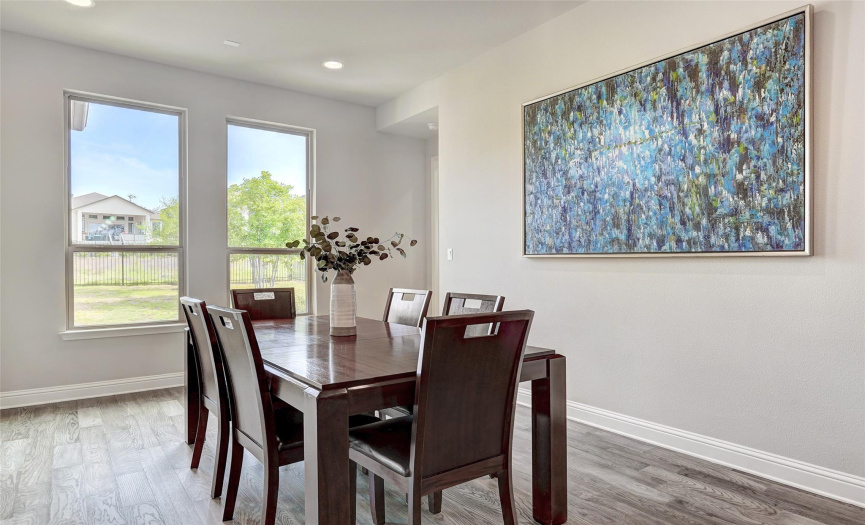 This spacious dining area is the perfect place to gather friends and family for a dinner party.