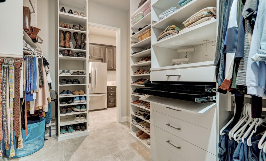 The primary closet is huge and fully customized, including jewelry drawers. Everything in your wardrobe will have a place!