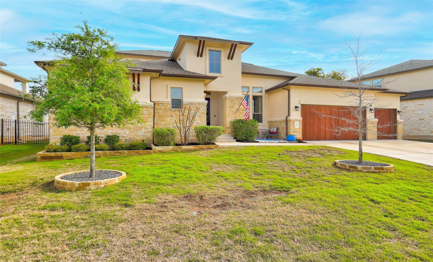 Beautiful curb appeal with attractive landscaping and a 3 car garage.