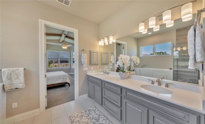 You will love relaxing in the soothing color scheme of the primary bath which is filled with upgrades.