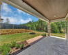 The rear patio is large enough for a barbecue and outdoor seating. The yard is maintained by the HOA.