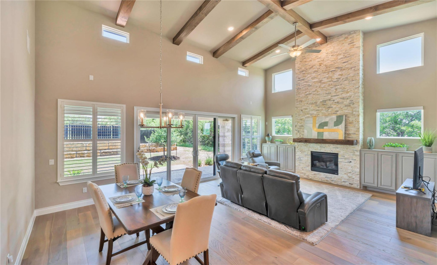 The dining area can accommodate a large group and has easy access to patio and kitchen. Reclining power sofa as well as all other new furniture can be included.