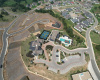 Arial view of Salus Clubhouse, pickleball courts and saltwater pool.