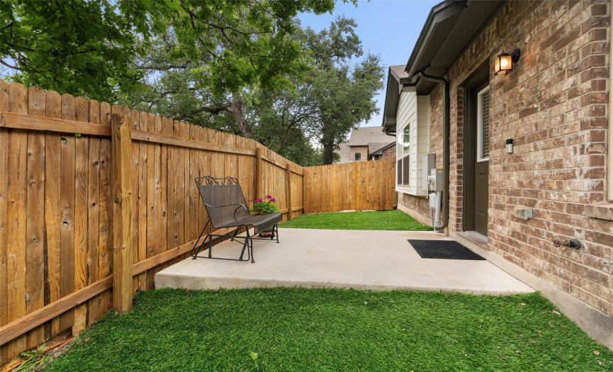 Great place to enjoy your morning coffee or a beverage in the evening. Beyond the privacy fence is a large green space. Only one side of this unit shares a wall and/or fence with the adjoining unit. 