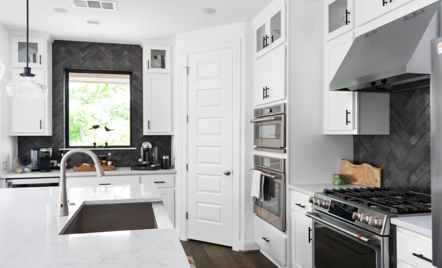 Elegant Kitchen Storage Solutions: This kitchen combines elegance and functionality with custom cabinetry and spacious storage options, perfect for keeping everything organized.