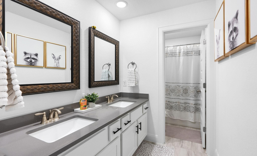 Elegant Bathroom with Dual Vanities: The third full bath offers dual vanities, complete with modern fixtures and beautiful finishes, creating a luxurious and practical space.