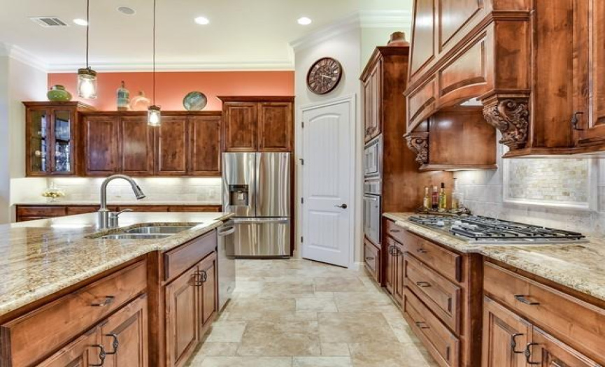 Joyfully spacious and welcoming kitchen. Ideal for entertaining. Expansive counters create a custom buffet.