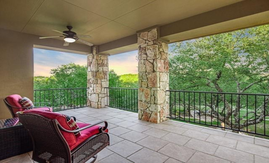 A covered verandah - approximately 306 square feet - offers an unrivaled view of the woods and hills.