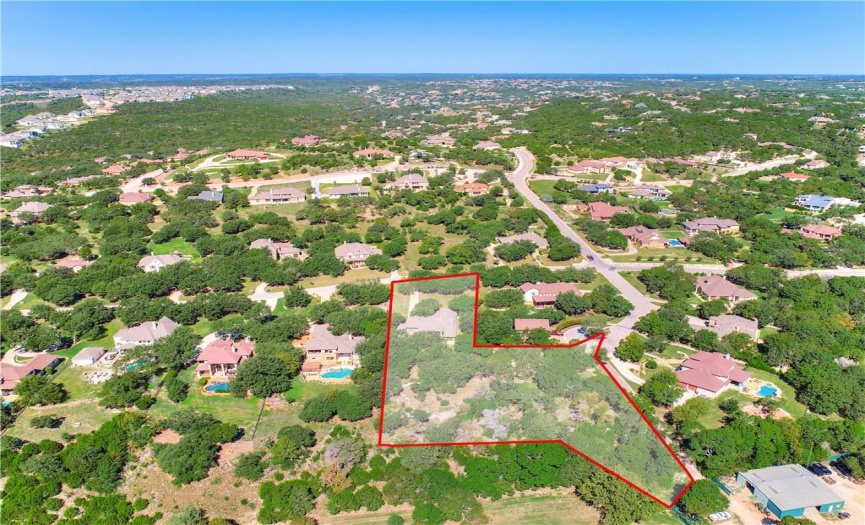 Aerial view of both the property and the adjacent lot.