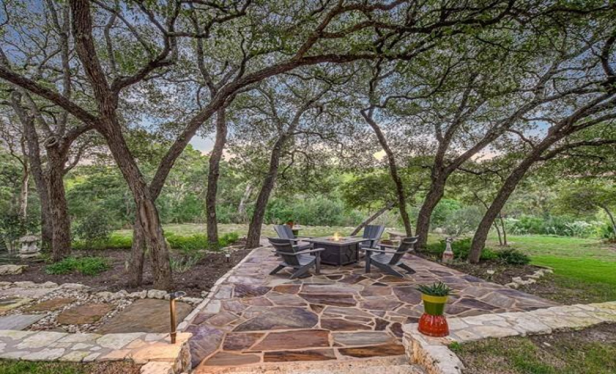 One of the many lounge areas made of approximately 375 feet of Oklahoma flagstone is the perfect place to kick back, relax and embrace the gentle breeze. The Crystal Falls Golf Course and hill country await you on the other side.