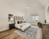 Primary Bedroom with vaulted wood ceilings. 