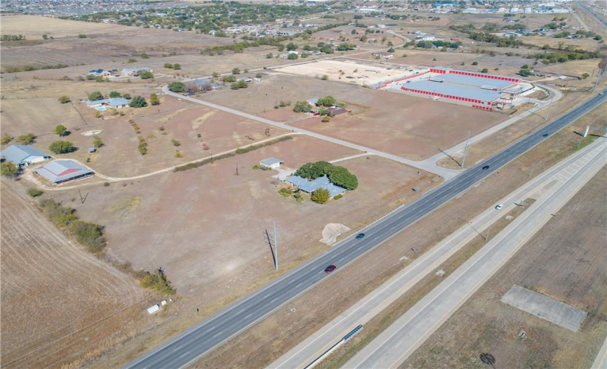 Aerial shot (home surrounded by trees) shows the reason Pflugerville Self Storage chose their land--thousands of rooftops nearby 
