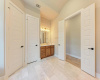 Bathroom is equipped with marble flooring, private water closet and separate linen closet. 